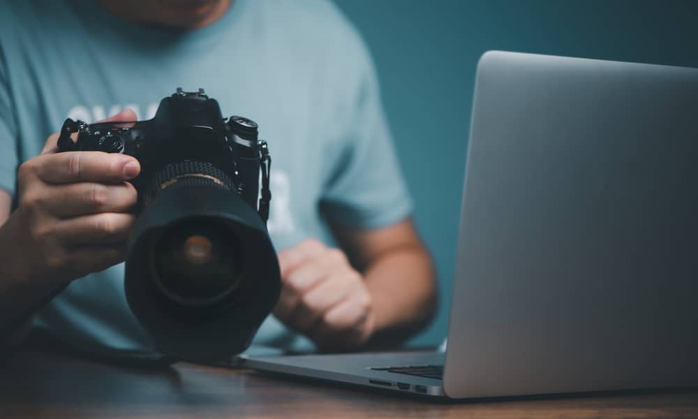 Young man learning to use and setting dslr camera online
